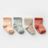 et of four striped baby socks in peach, sage, cream, and terracotta